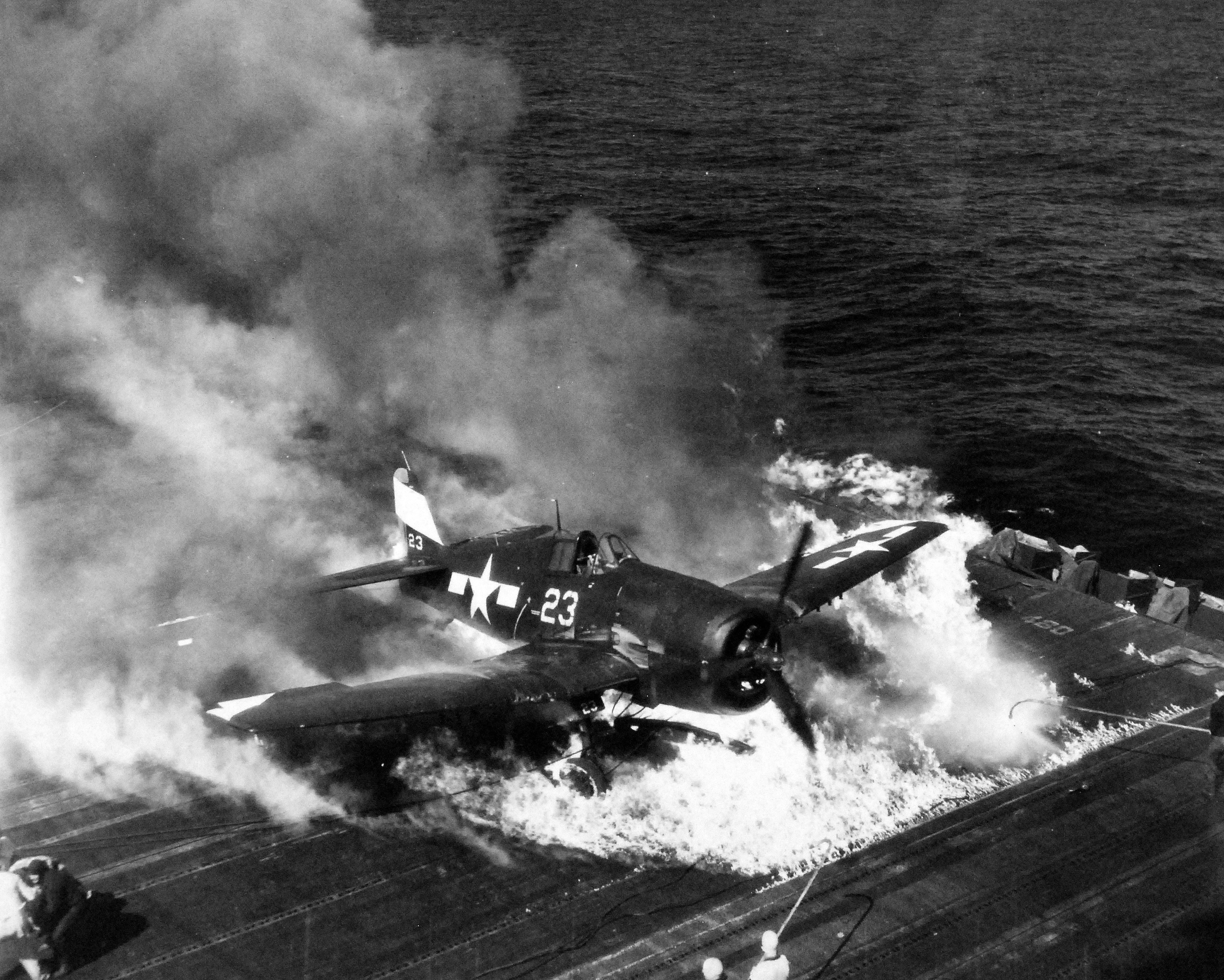 Ensign Ardon R. Ives of Fighting-Bombing Squadron VBF-9 crashed his F6F-5 Hellcat through the barrier on USS Lexington (Essex-class) and ruptured the center-line fuel tank, Feb 1945, western Pacific. Photo 7 of 7