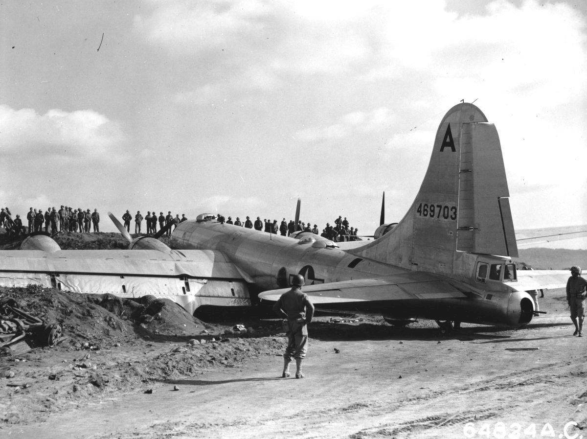 B-29 crash-landed on Motoyama Airfield, Iwo Jima, Bonin Islands, after fighters disabled two engines on a bombing run over Osaka, 10 Mar 1945. Photo 2 of 2.