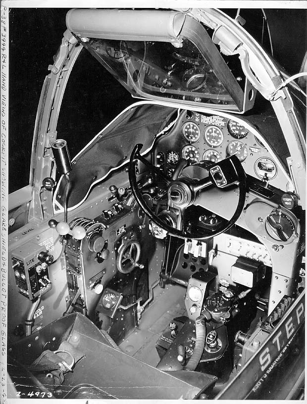 Close-up view of a P-38G Lightning aircraft cockpit, 23 Dec 1942; note the yoke rather than stick control and the bullet proof glass panel above the instrument panel. Photo 3 of 3.