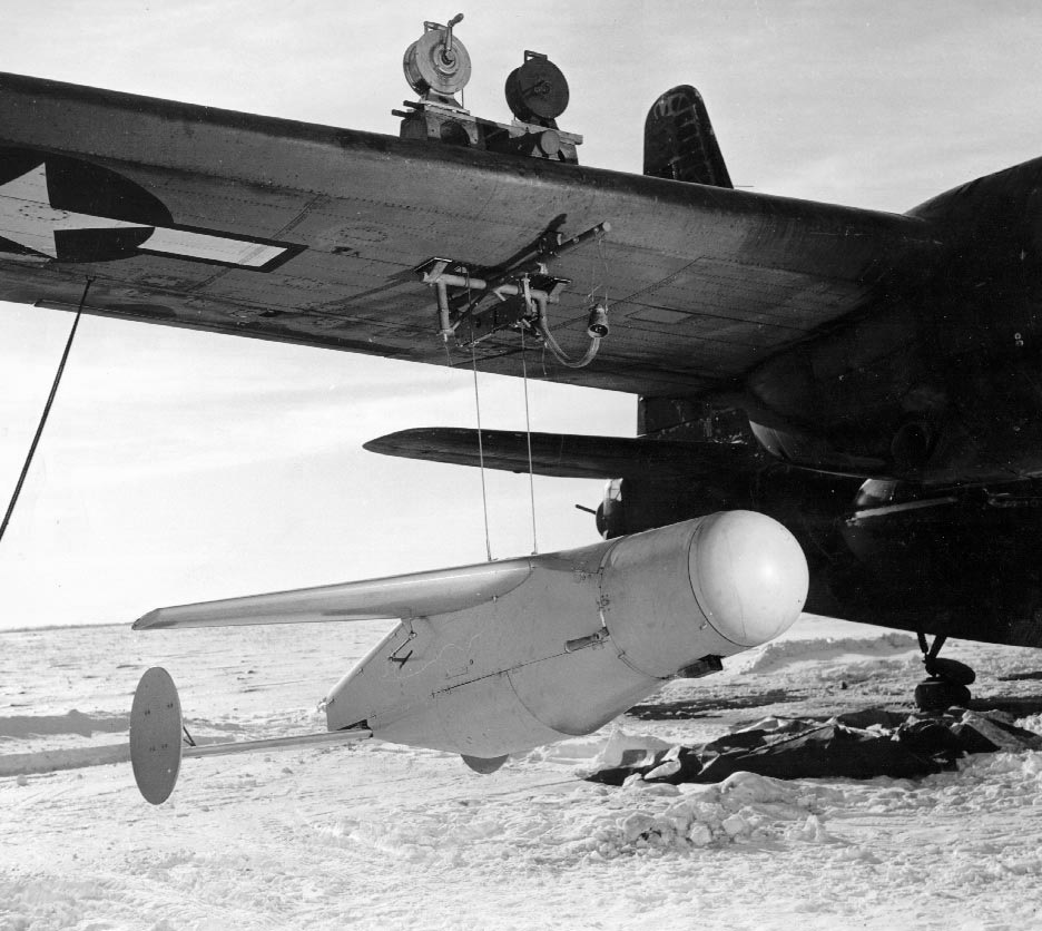 Bat radar guided anti-shipping bomb on cables for hoisting to the under the wing mount on a US Navy PB4Y-2 Privateer of Patrol Bombing Squadron VPB-109, western Pacific, mid-1945.