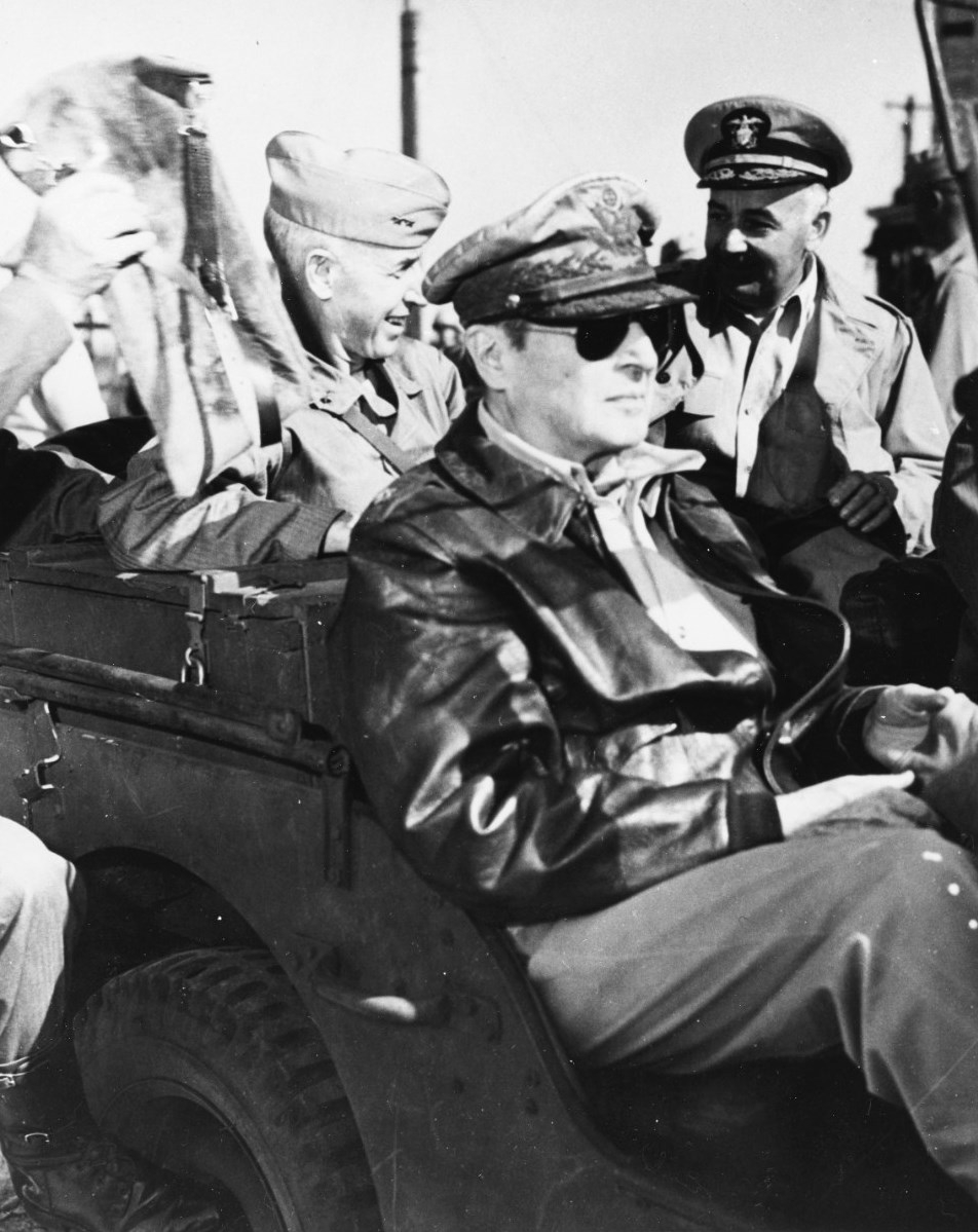 Douglas MacArthur on a jeep tour of the port facilities at Inchon, South Korea, 16 Sep 1950. Behind him are Marine Major General Oliver P Smith and Navy Vice Admiral Arthur D Struble.