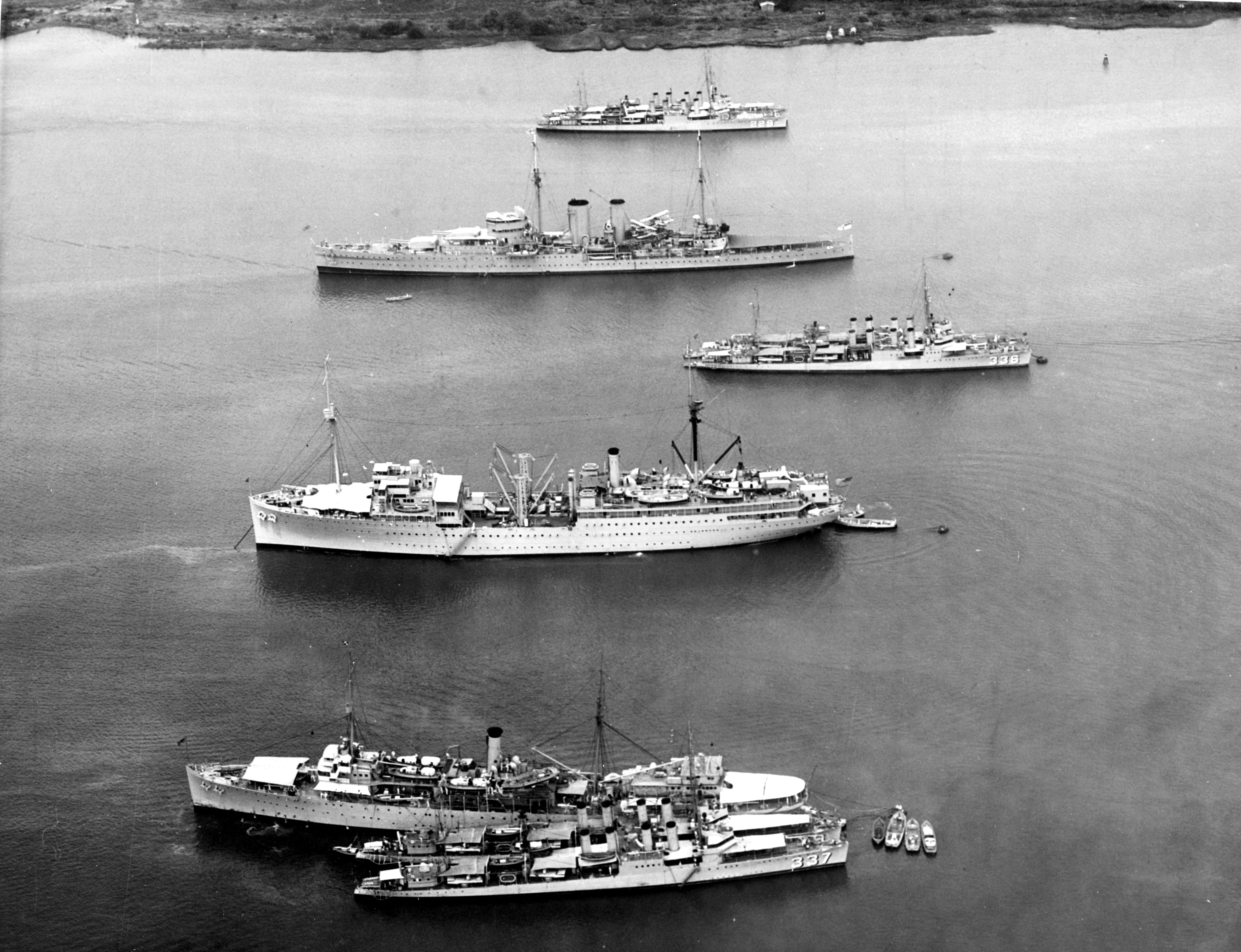 USS Melville (foreground, with USS Zane and another destroyer), USS Medusa, USS Litchfield (with another destroyer), HMS Exeter, and USS Truxtun (background, with another destroyer) in Balboa harbor, Panama Canal Zone, 24 Apr 1934