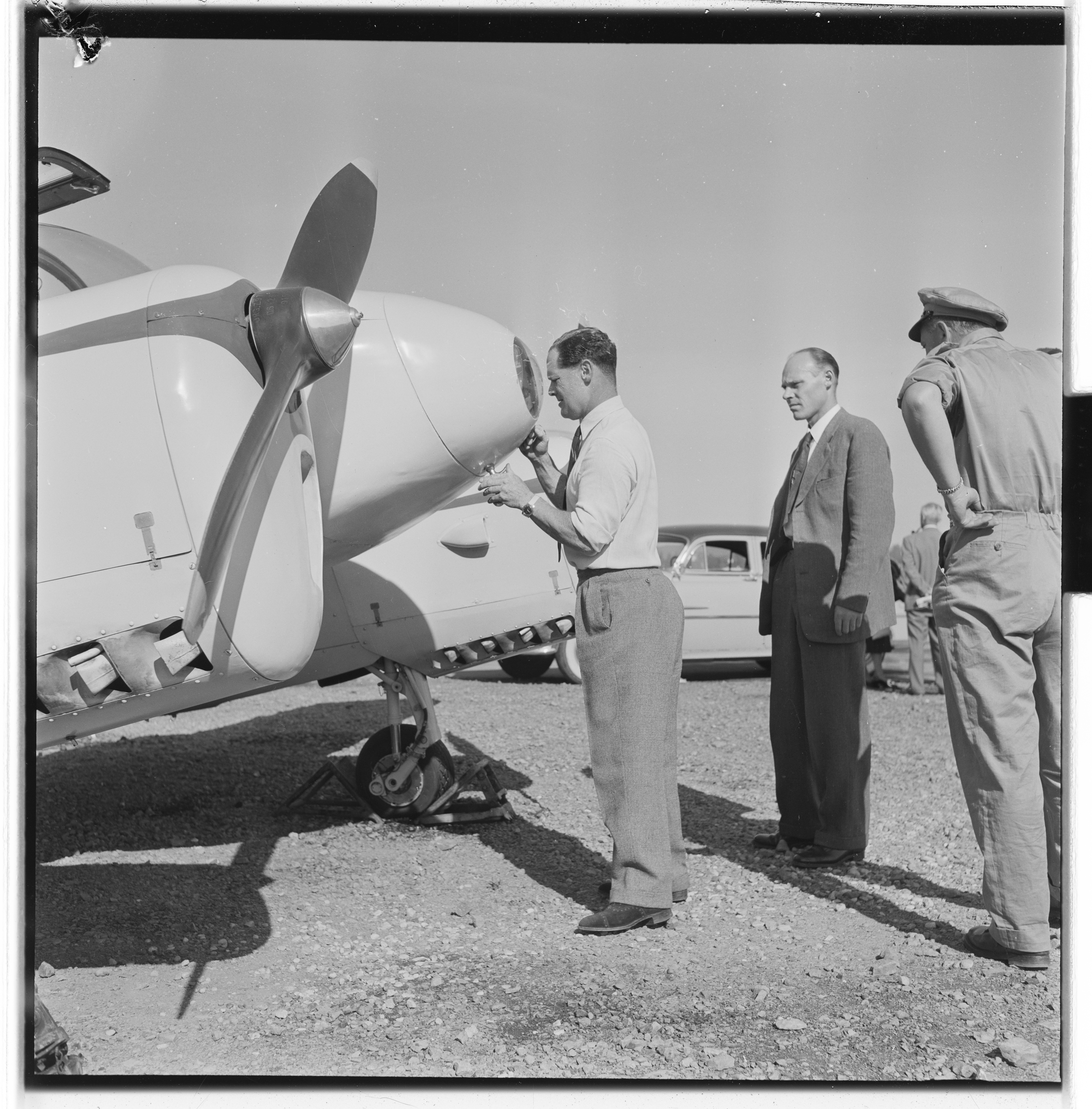 Douglas Bader inspecting a Norwegian Gemini aircraft, Fornebu, Bærum, Akershus, Norway, 1955, photo 3 of 8