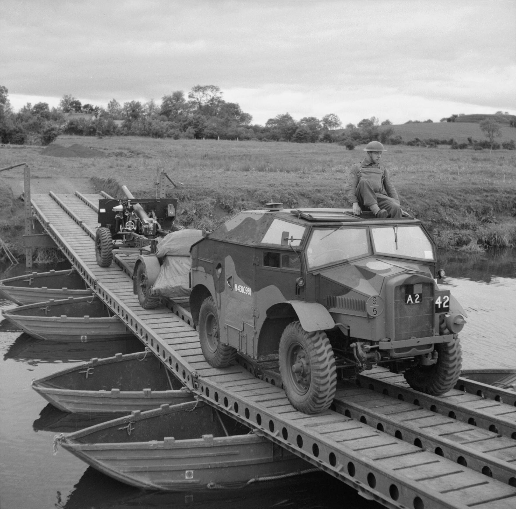 C8 and 25-pdr field gun crossing a pontoon bridge near Slaght Bridge, County Antrim, Northern Ireland, United Kingdom, 26 Jun 1942