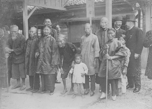 Elderly civilians at a small rail station attempting to catch a glimpse of Crown Prince Hirohito, who would be passing by aboard a train, Taiwan, 20 Apr 1923