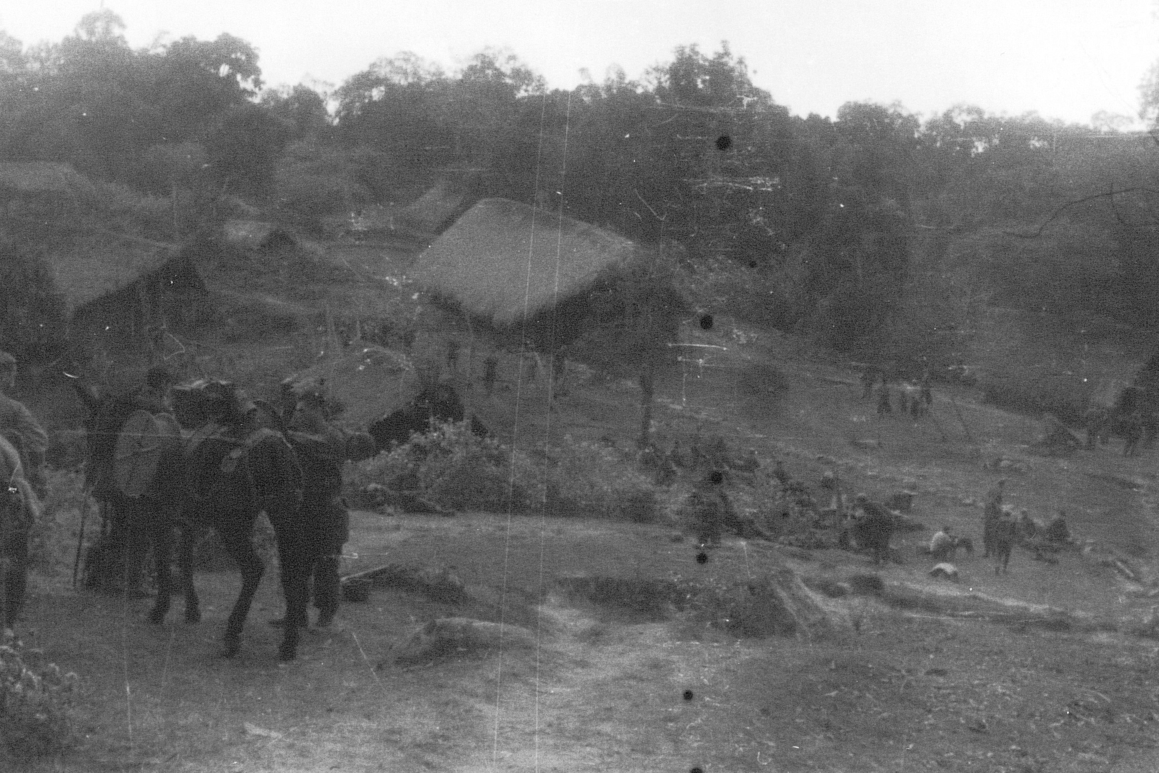 Members of US 5332nd Brigade (Provisional) at a village between Ningpawn and Pranglui, Burma, 3 Jan 1945
