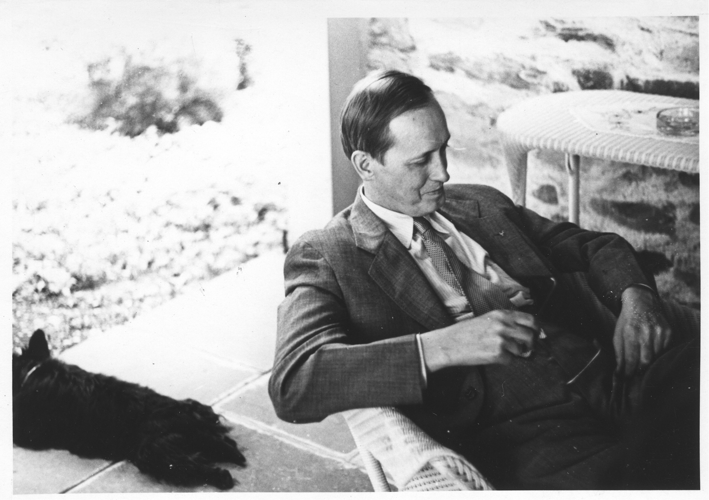 Harry Hopkins with Franklin Roosevelt's pet dog Fala, Top Cottage, Hyde Park, New York, United States, 1942