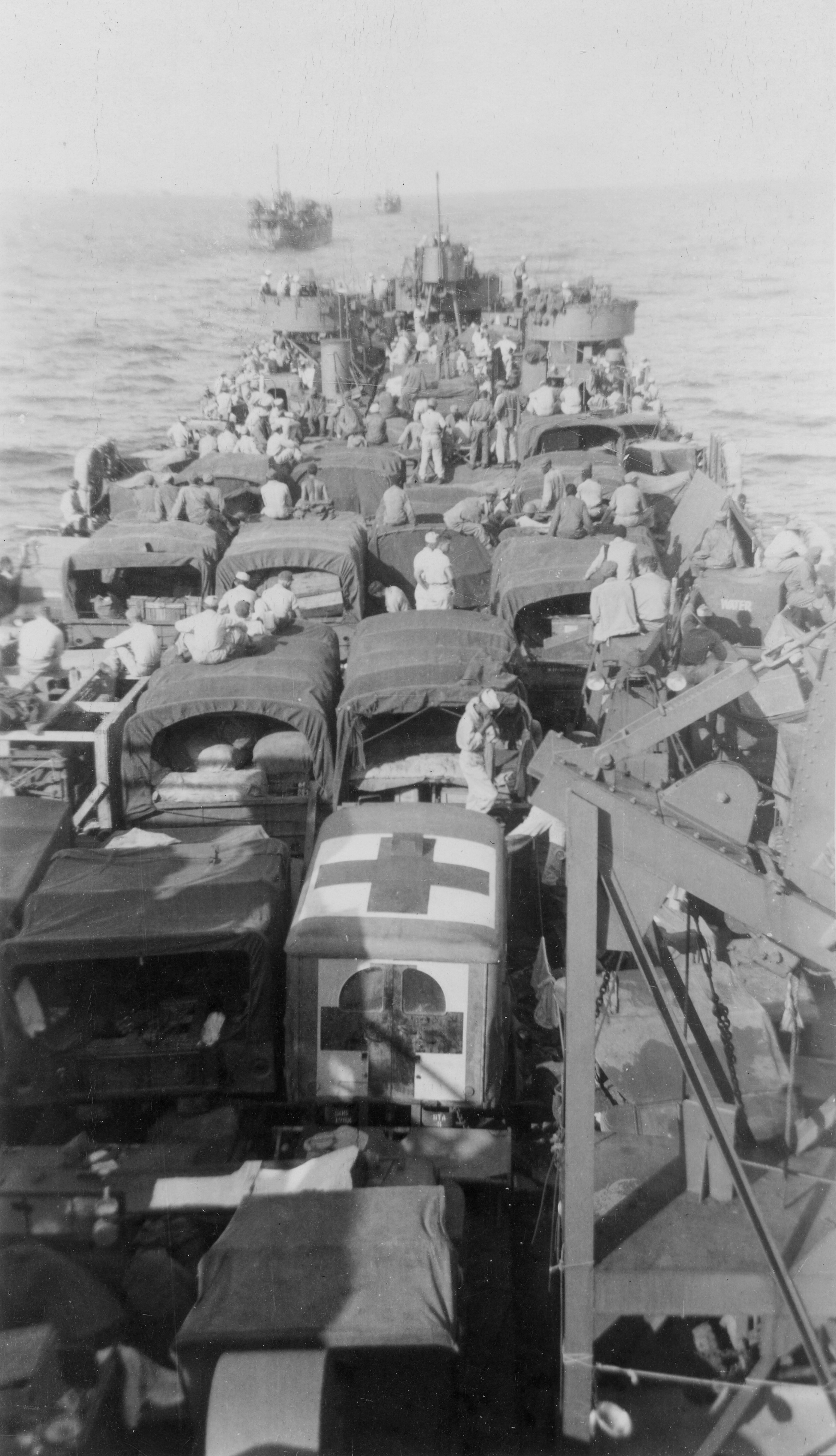 A United States Navy LST ferrying a US Army field hospital unit toward Omaha Beach, Normandie, France, 6 Jun 1944.