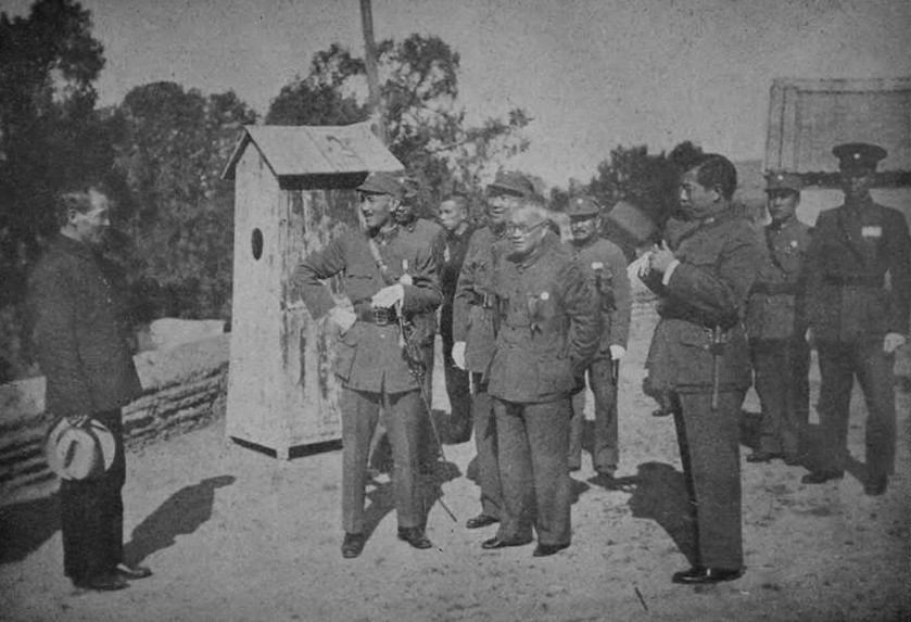 Chiang Kaishek speaking with a civilian at the Xi'an Raiway Station, Xi'an, Shaanxi Province, China, circa 30 Oct 1936; Chairman of Shaanxi Province Shao Lizi was standing next to Chiang