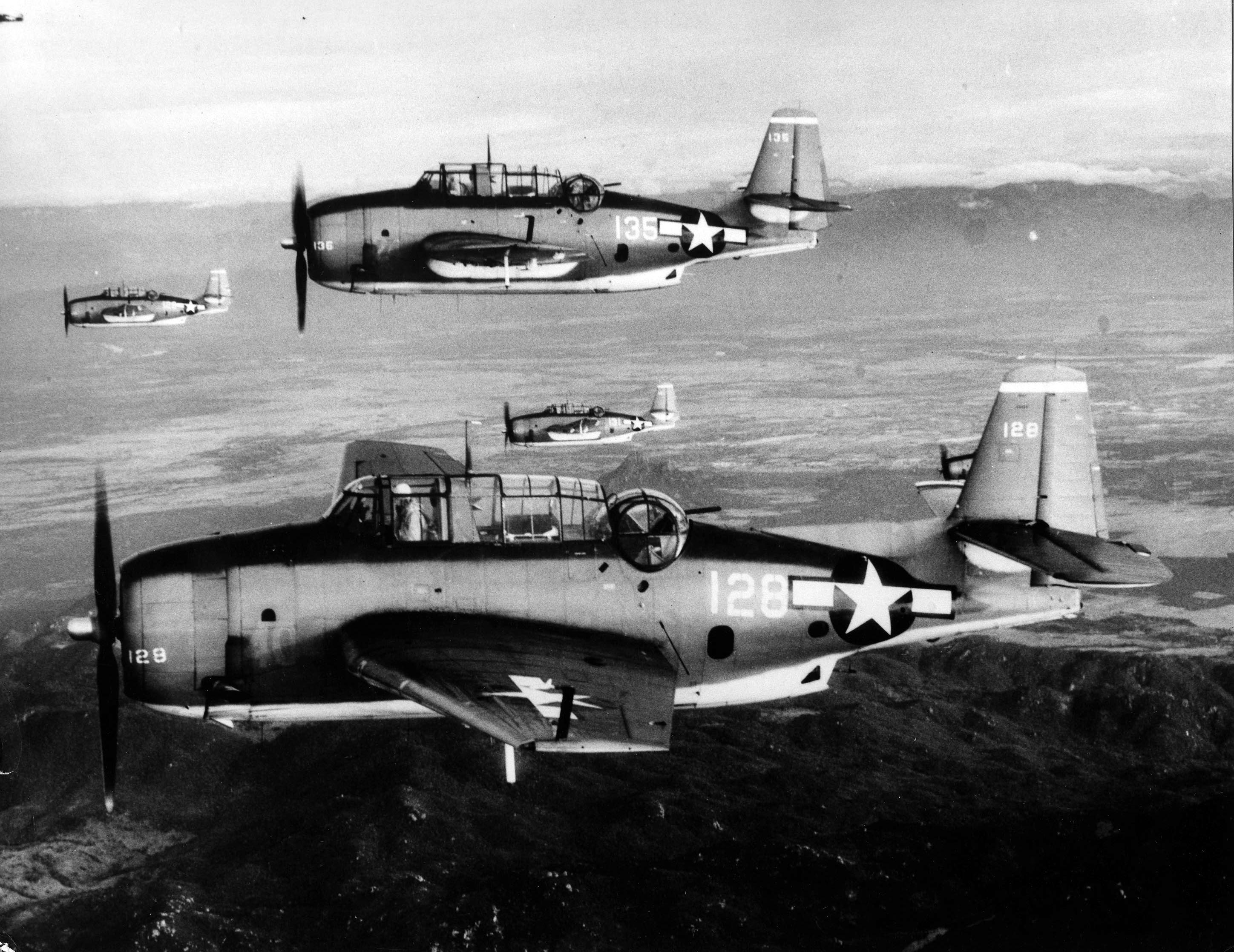 Four TBM Avengers of Torpedo Squadron 4 flying from the USS Essex on their way to strike targets along the coast of French Indochina (now Vietnam), 12 Jan 1945.