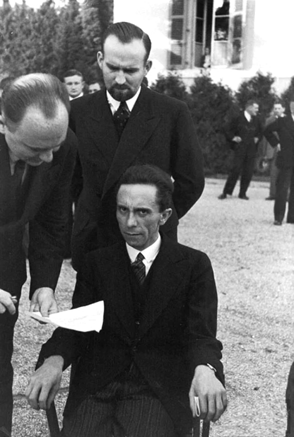Joseph Goebbels in the garden of the Carlton Hotel in Geneva, Switzerland during the League of Nations conference, Sep 1933. His glare is said to be upon learning the photographer was Jewish.