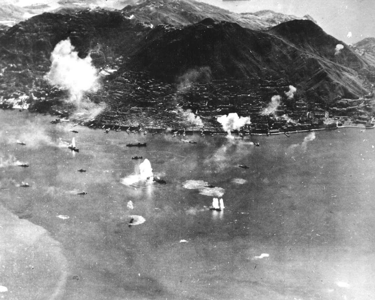 The port of Honk Kong under attack by American planes from Task Force 38, 16 Jan 1945, while Task Force 38 was still in the South China Sea.