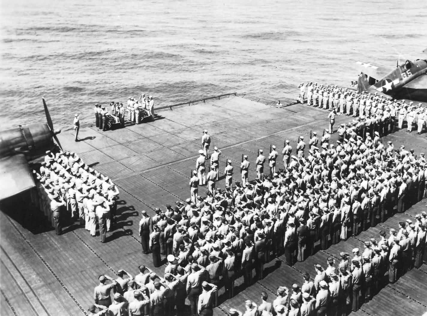 Burial at sea services aboard USS Lexington (Essex-class) following action around Palau, 2 Apr 1944.