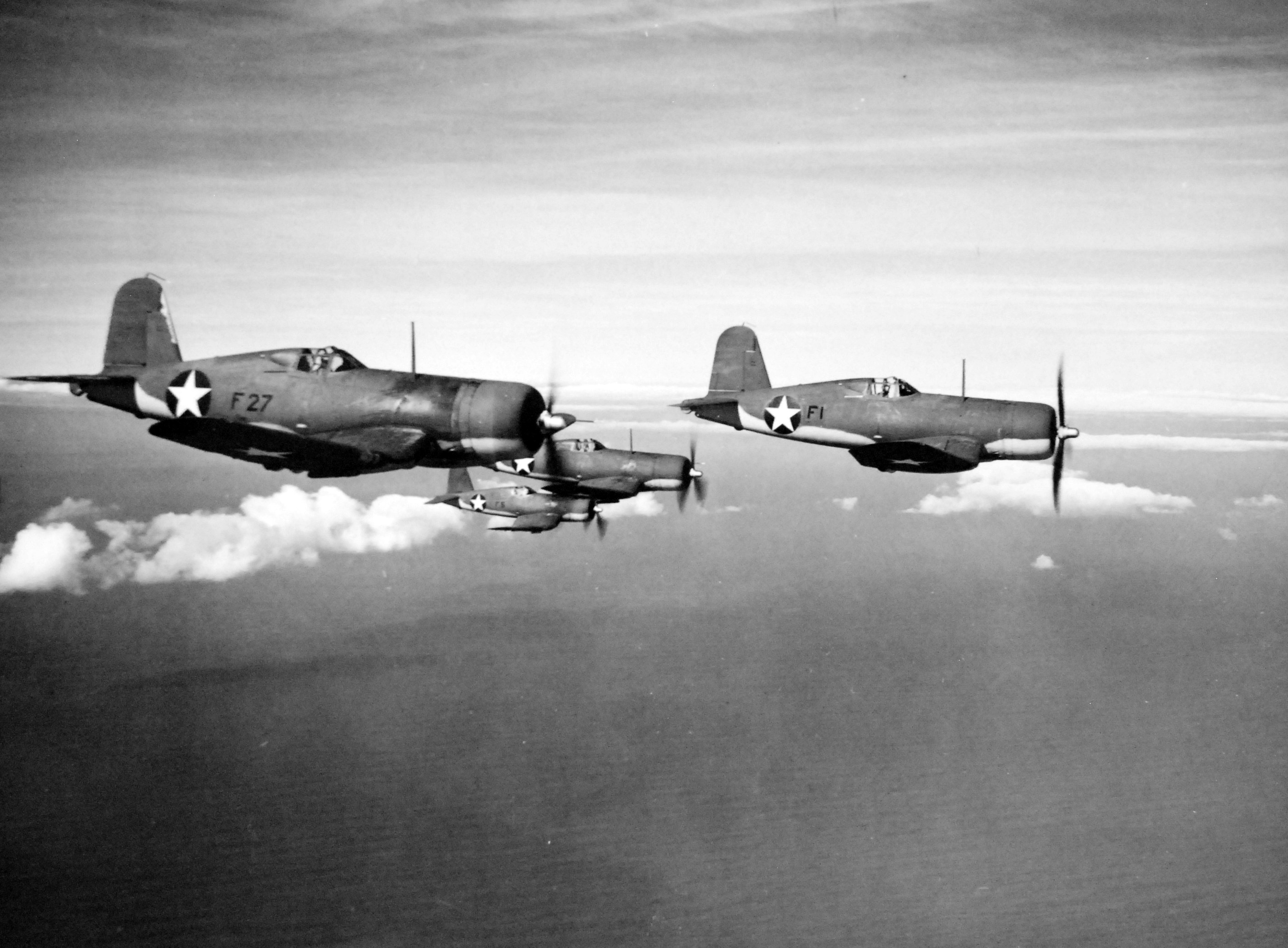 Four F4U Corsair fighters practicing aerial maneuvers, Mar-May 1943; probably stateside training. Photo 1 of 2.