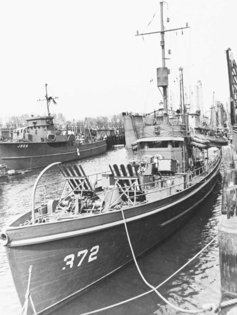 United States Coast Guard cutter WPC-372 in New York Harbor, spring 1942. Note Mousetrap anti-submarine rocket rails on her foredeck. Photo 2 of 3.