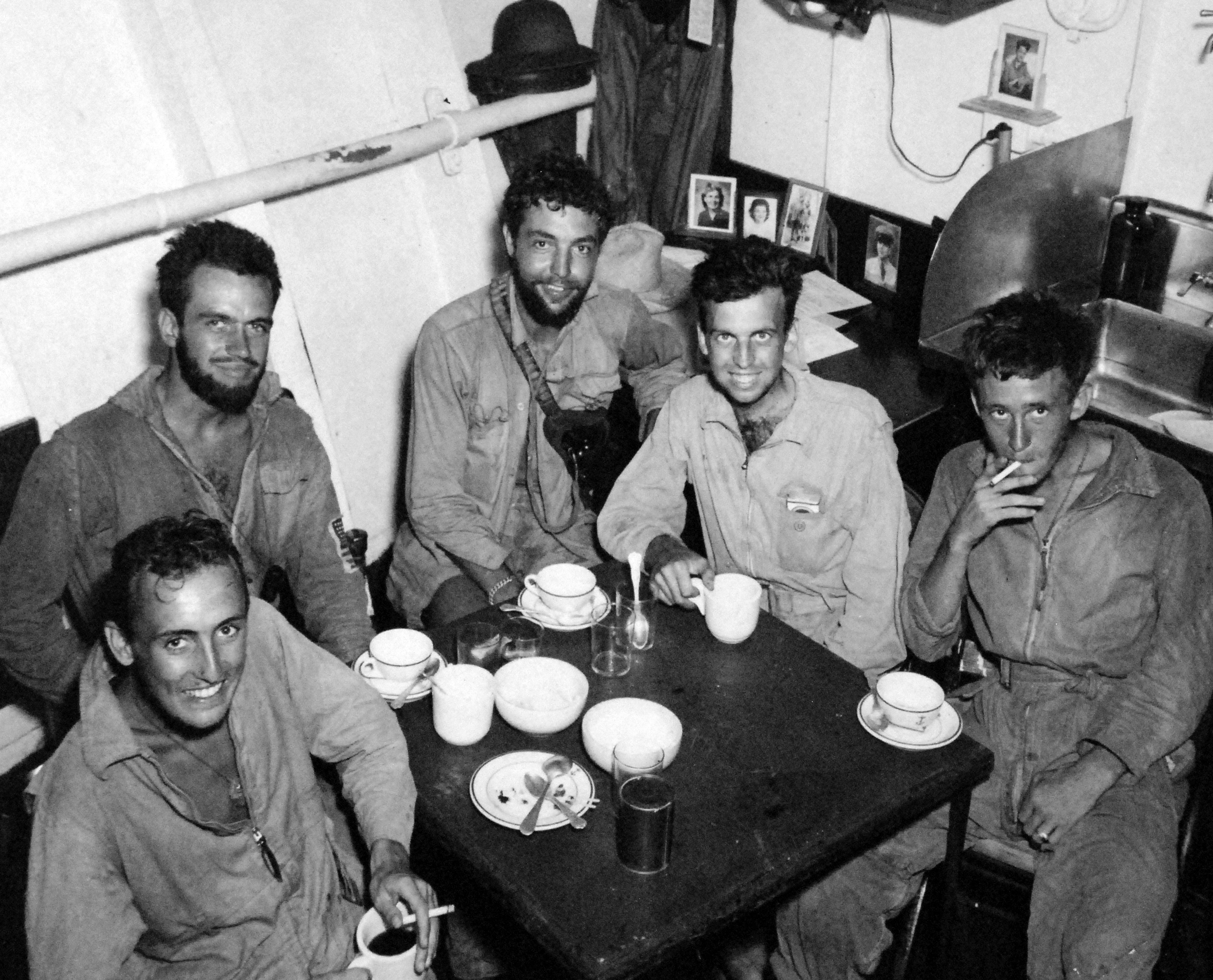 Aboard the seaplane tender USS Tangier in San Pedro Bay, Leyte, Philippines 10 Jan 1945 are five downed United States Navy airmen rescued the day before by a PBY Catalina near Subic Bay, Luzon, Philippines.