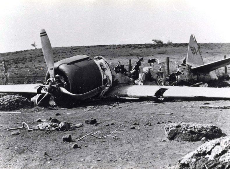 Shigenori Nishikaichi’s A6M Zero fighter after he crash landed on Ni'ihau, Hawaii and burned his airplane. This airplane was damaged during the Pearl Harbor attack of 7 Dec 1941. 17 Dec 1941 photo. Photo 1 of 2.