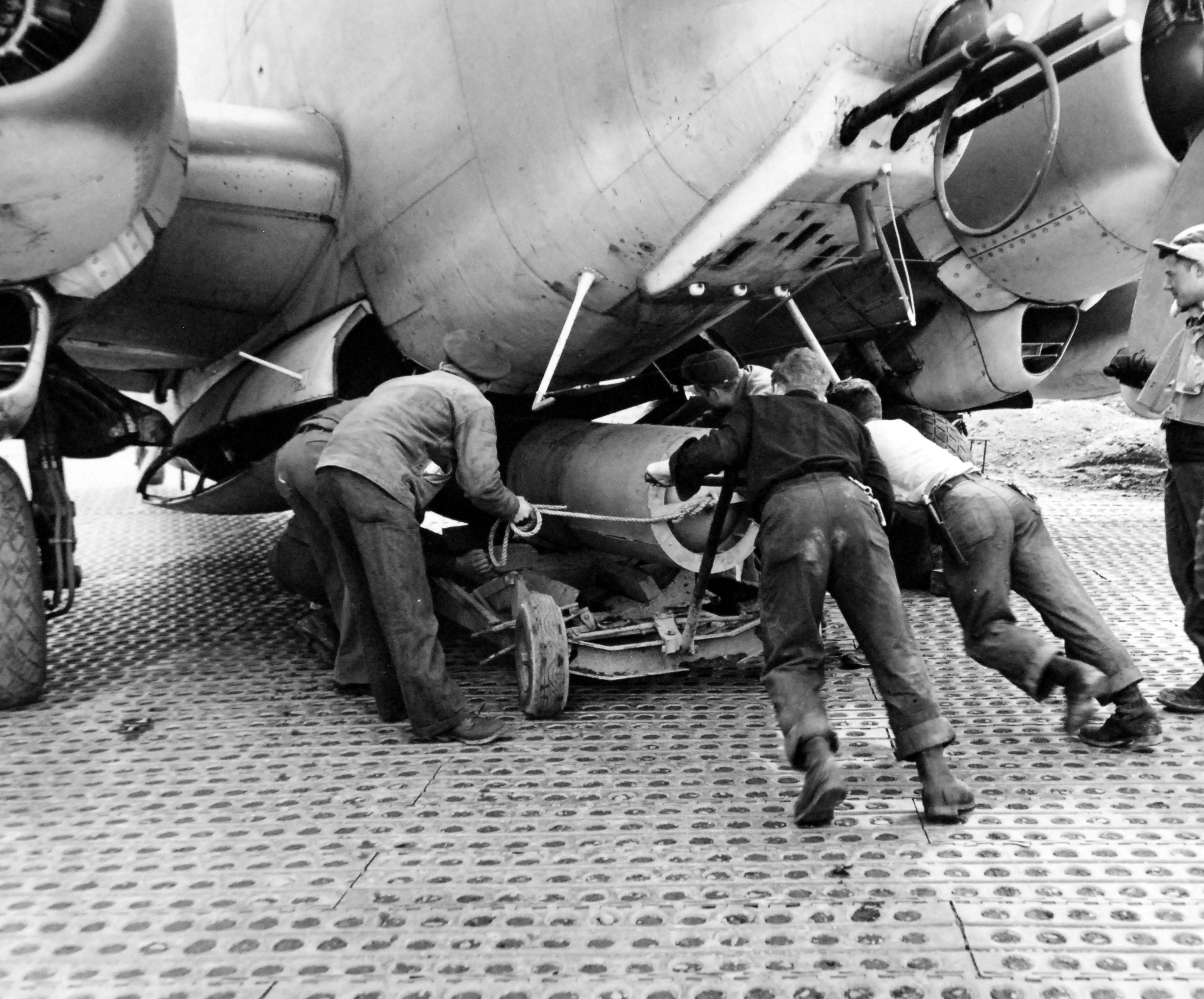 Mark XIII torpedo with wooden drag ring being loaded into a United States Navy PV-1 Ventura at Casco Field, Attu Island, Aleutians, Alaska, 17 Arp 1945. Note the Marsden Matting.