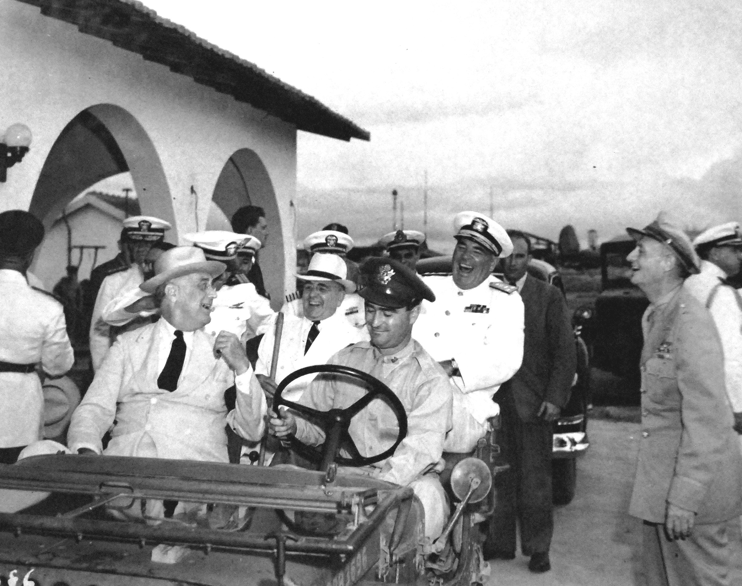 Franklin Roosevelt inspecting facilities in Natal, Brazil as he travels back to the United States after the Casablanca Conference, 28 Jan 1943. Brazilian president Getulio Vargas is seated in the back seat of the Jeep.