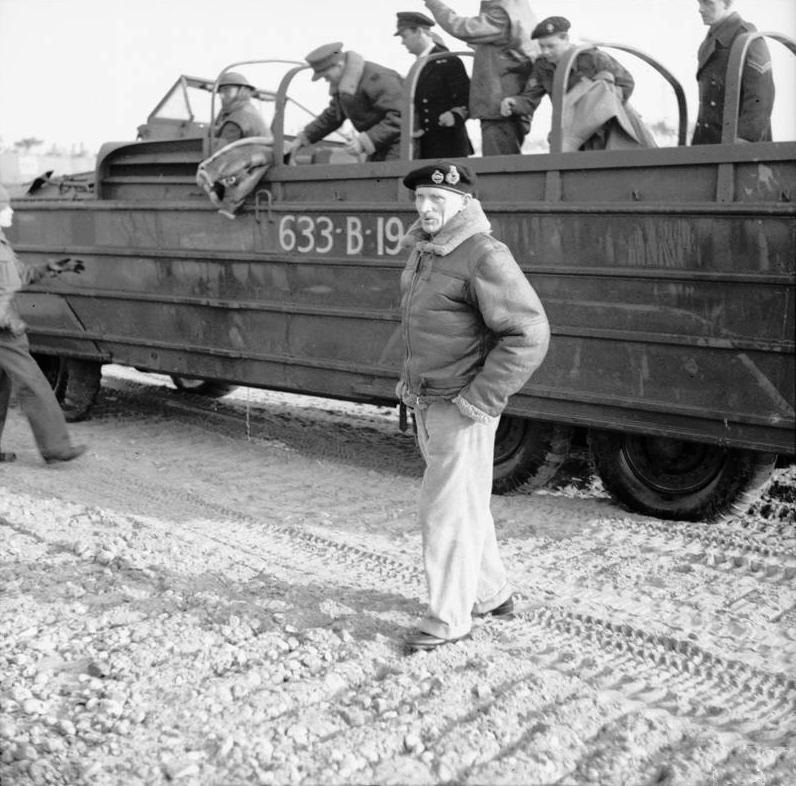 General Sir Bernard Montgomery, 21st Army Group Commander, steps onto Juno Beach, Mike Red area, Courseulles-sur-Mer, Normandy, France 8 Jun 1945 after being ferried ashore from his ship in a DUKW.