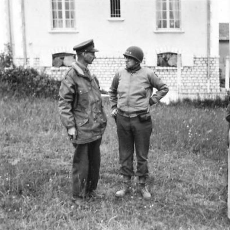 Generals Omar Bradley and Miles Dempsey at a meeting in the field in Port-en-Bessin, France during the Normandy campaign, 10 Jun 1944.