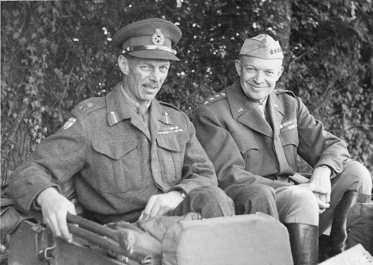 Generals Miles Dempsey and Dwight Eisenhower in the back of a Jeep during a meeting at Field Marshal Bernard Montgomery’s headquarters in northern France, Sep 1944.