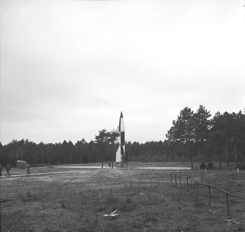 A reassembled German V2 ballistic rocket on a stand for Allied testing at former the Krupps proving grounds at Cuxhaven, Germany, Oct 1945.