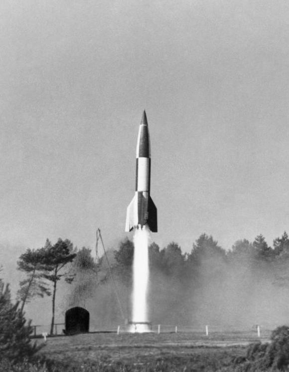A German V2 rocket at the moment of launch during Allied tests at the former Kupps proving grounds, Cuxhaven, Germany, 10 Oct 1945.