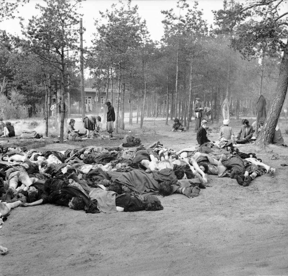 Women prisoners at the Bergen-Belsen Concentration Camp preparing food in the open air with scores of rotting corpses all around them, 17 Apr 1945 (food provided by the British). Photo 2 of 3.
