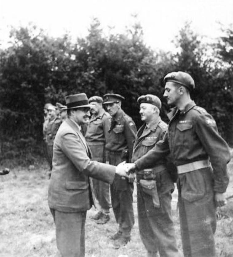 British Secretary of State for War, Sir James Grigg, greeting Eighth Corps senior officers at Corps headquarters in Normandy, France during a tour of the forward areas, 16 Aug 1944.