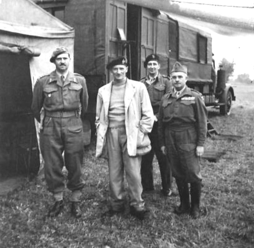 Prince Felix of Luxembourg, General Bernard Montgomery, French Colonel Candeau, and Brigadier General Christopher Peto at 21st Army Group headquarters at Blay, Normandy, France, 1 Sep 1944.