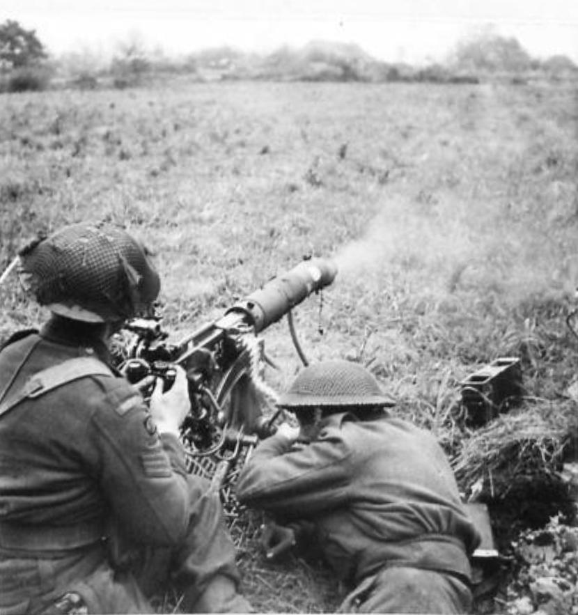 Machine gunners of the 1st Battalion, Middlesex Regiment, firing the Vickers machine gun in support of the 6th Royal Scots Fusiliers between Meijel and Liessel, Netherlands, 1 Nov 1944.