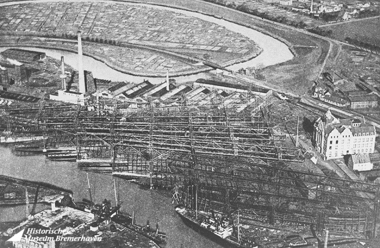 Aerial view of the slips of Tecklenborg shipyard and the twisting Geeste River, Bremerhaven, Germany, date unknown