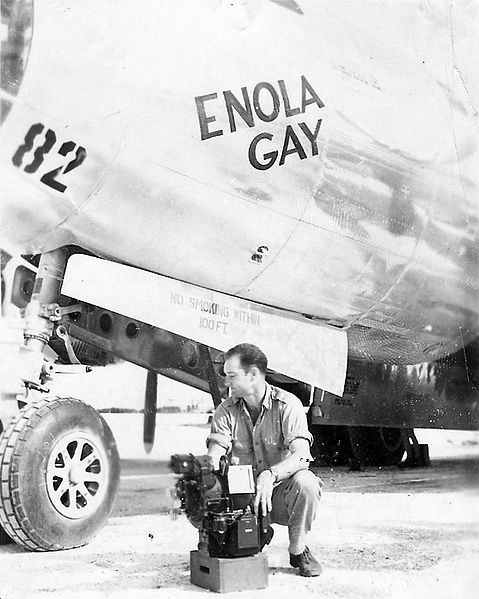 Thomas Ferebee, bombadier of B-29 Bomber Enola Gay, with Norden bombsight, Tinian, Mariana Islands, 6 Aug 1945