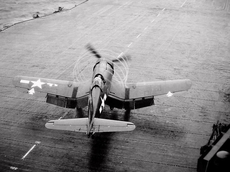 F4U Corsair preparing for a deck launch from USS Bennington around Okinawa in the Western Pacific, Apr 1945. Note the arrowhead geometrics that identify the plane as coming from the Bennington.