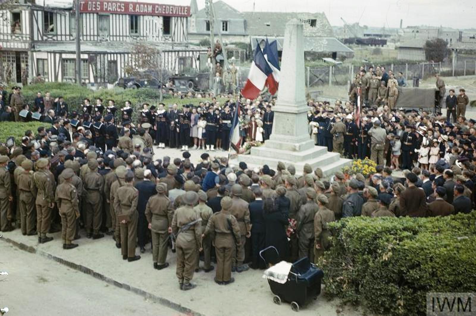 British and American troops join with residents of Courseulles-sur-Mer in Bastille Day ceremonies at the town’s War Memorial. Courseulles-sur-Mer was the first town in Normandy to be liberated by the Allies.