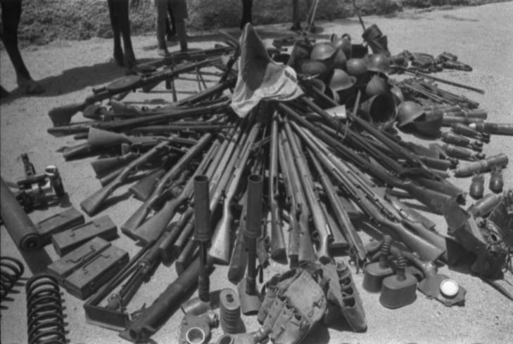 Captured Japanese equipment, Hubei Province, China, 1942, type 1 of 2; note Arisaka Type 38 rifles, Type 89 grenade launchers, Type 91 or 95 gas masks, DP machine gun, helmets, bayonets, grenades