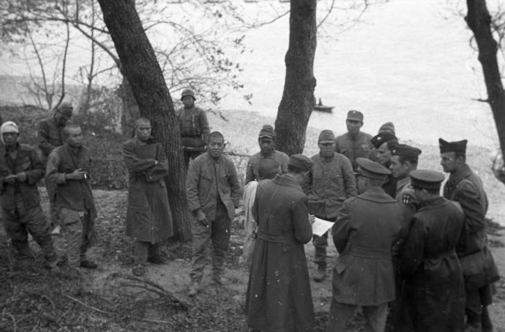 Chinese and American officers interrogating Japanese prisoners of war, Changde, Hunan Province, China, 25 Dec 1943