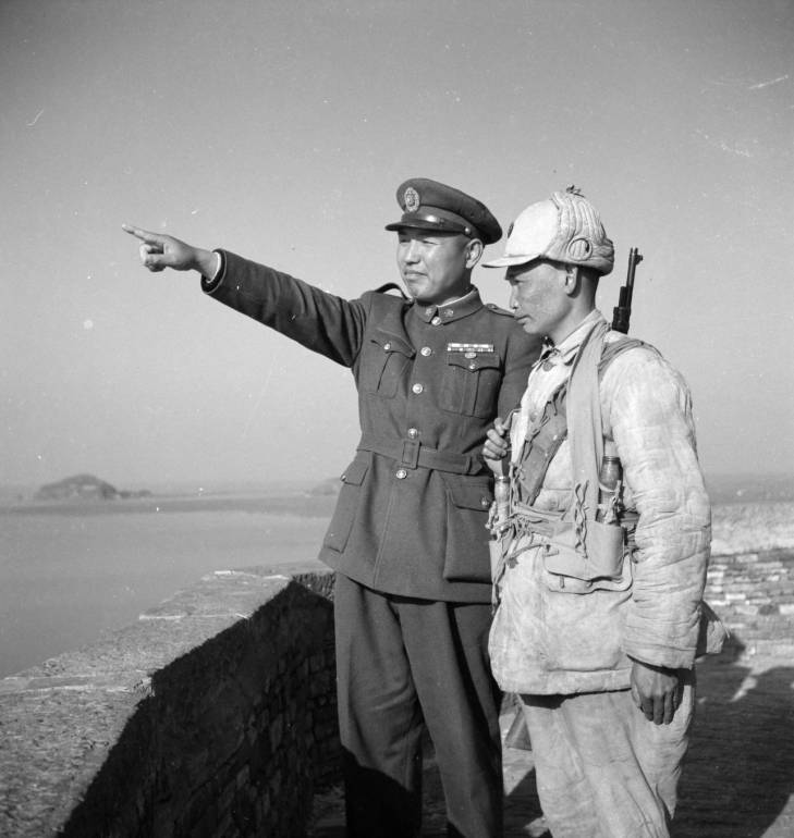 A Chinese major and a soldier atop a fortification, Chongqing, China, fall of 1937