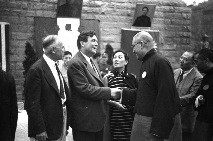 Wendell Wilkie, Song Meiling, and others at an event held in honor of special envoy Wendell Wilkie, Henan Province, China, 1942; note Kong Xiangxi (H. H. Kung) in background