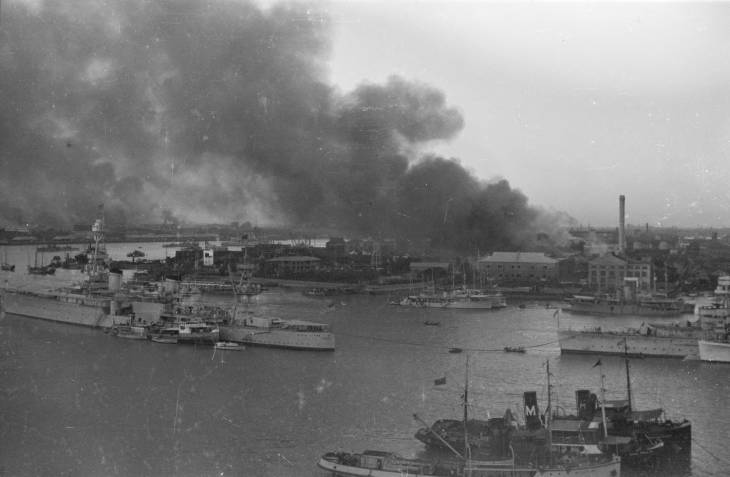 Smoke rising from Shanghai, China, Aug-Sep 1937, photo 1 of 2; note USS Augusta in foreground left and HMS Suffolk in foreground right