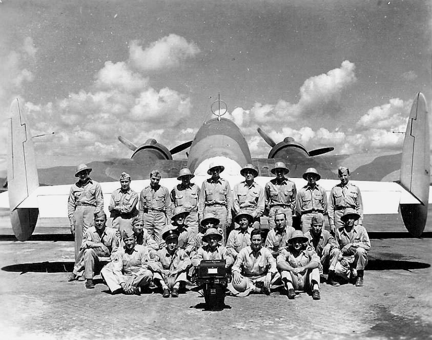 Group photo of the USAAF 3rd Mapping Squadron standing in front of a B-36 Lexington bomber during a stopover at Borinquen Field, Puerto Rico on their way to South America, 1942.
