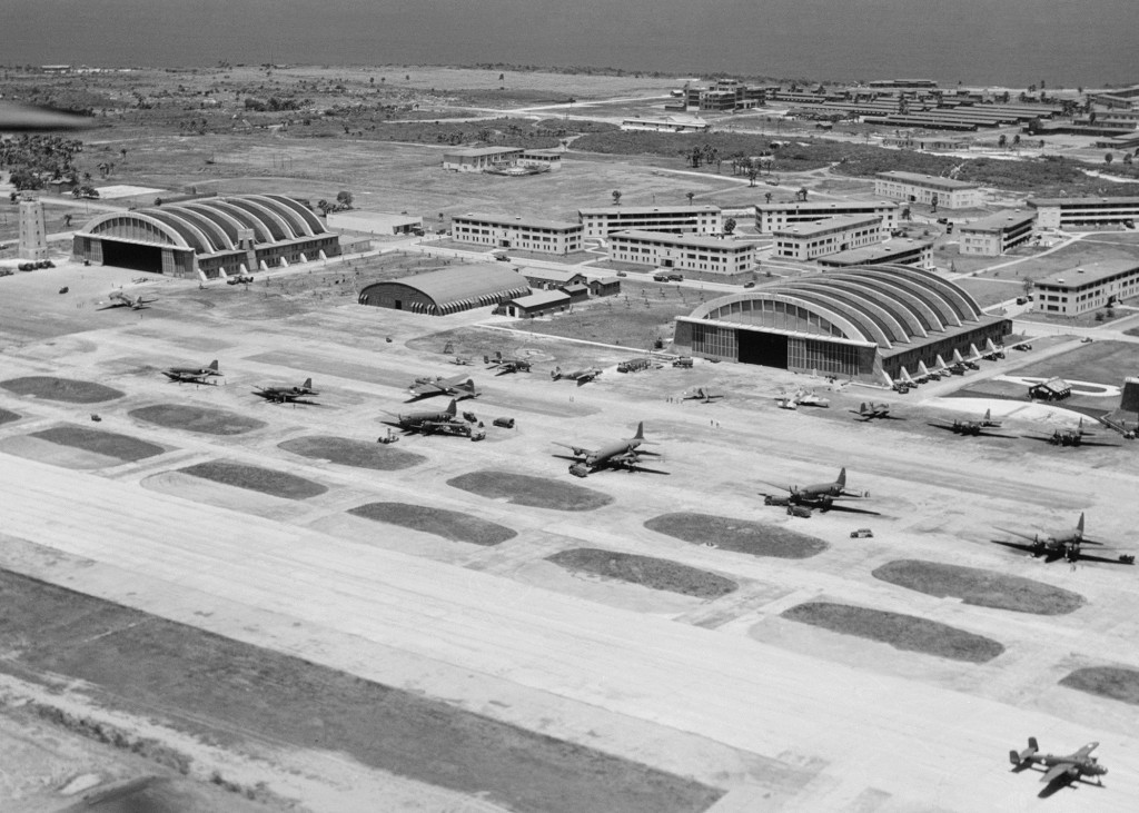 Aerial view of the tower, hangars, and pad at Borinquen Field, Puerto Rico, 1943. Aircraft seen include C-46, C-47, C-54, B-17, B-25, B-18, B-34, A-20, and perhaps others.