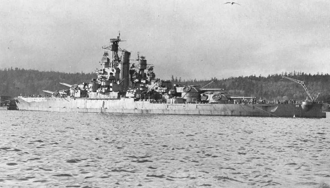 After exiting drydock, USS Nevada laid at anchor for one day in Sinclair Inlet off Puget Sound Naval Shipyard, Bremerton, Washington, United States, 5 Dec 1942.