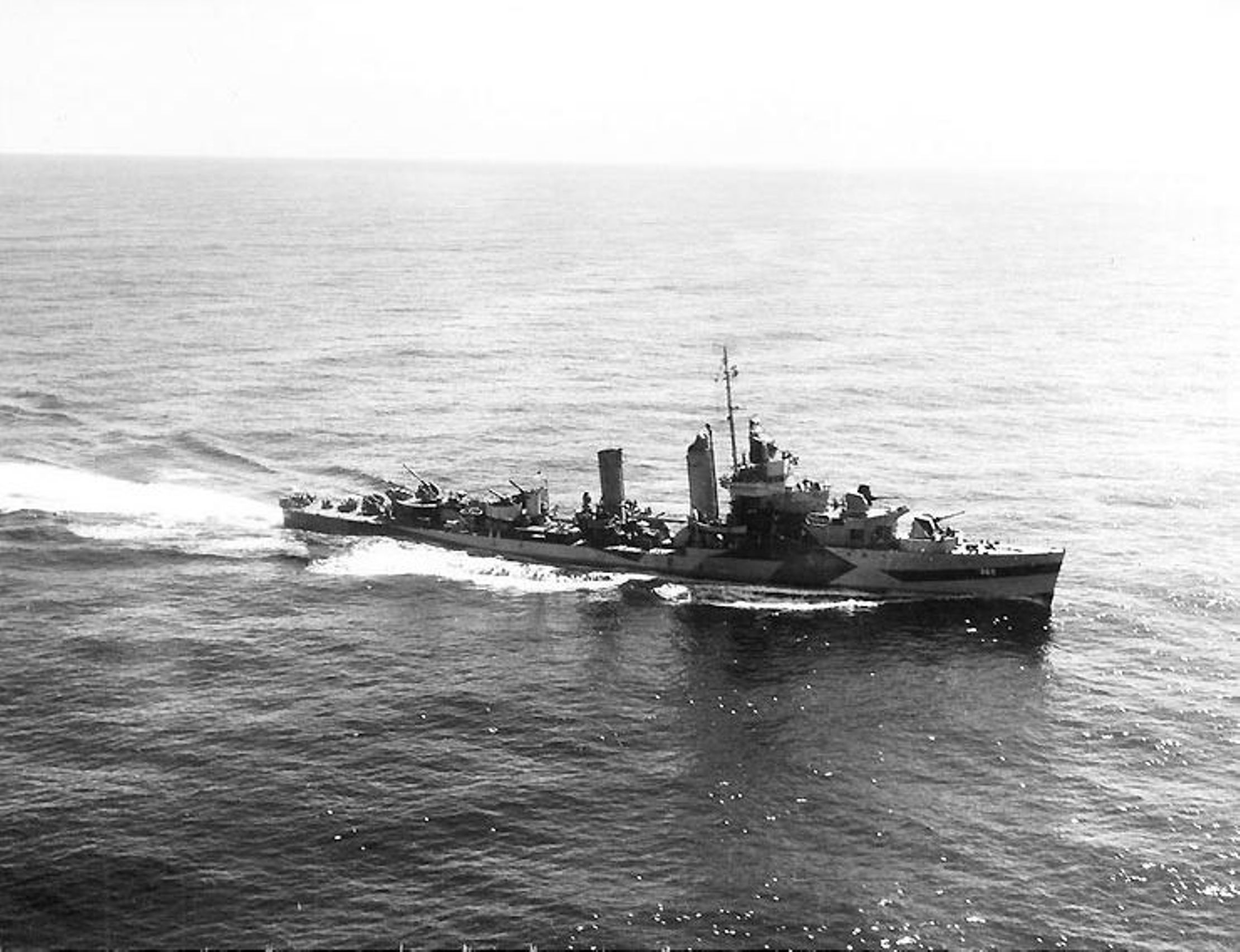 USS Cummings in Measure 32 Design 23D paint scheme as seen from an aircraft from USS Monterey while approaching Wake Island for a bombardment, 3 Sep 1944. Photo 2 of 2.