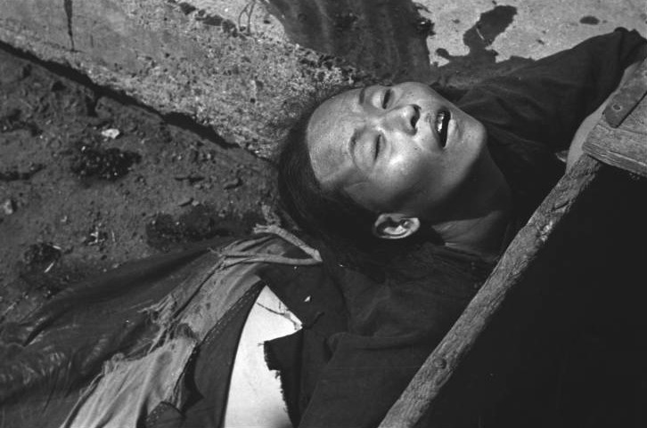 Chinese woman killed by Japanese bombing at the side of a bridge, Shanghai, China, mid-1937, photo 3 of 3