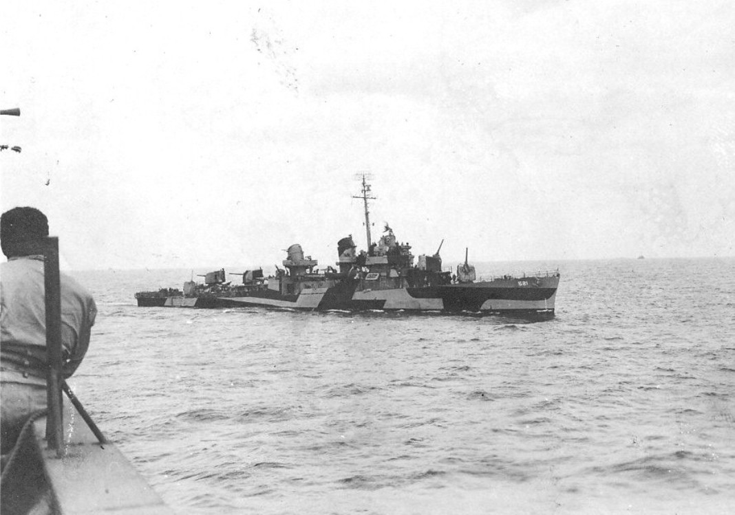 Destroyer USS Kimberly in Measure 32/6D paint scheme seen from an LST south of Okinawa, Japan, 29-31 Mar 1945.
