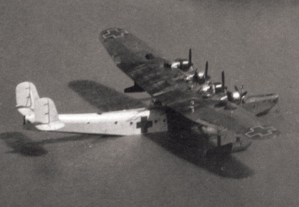 Kawanishi H6K ‘Mavis’ flying boat in surrender paint scheme abandoned at Surabaya, Java, 1945.