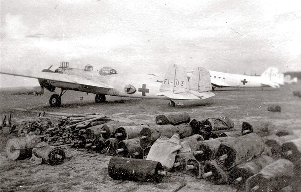 Mitsubishi G3M ‘Nell’ bomber in surrender paint scheme abandoned at Seletar Airfield, Singapore, 1945. Note the Nakajima L2D ‘Tabby’ aircraft beyond, license-built copy of the Douglas DC-3, also in surrender paint.