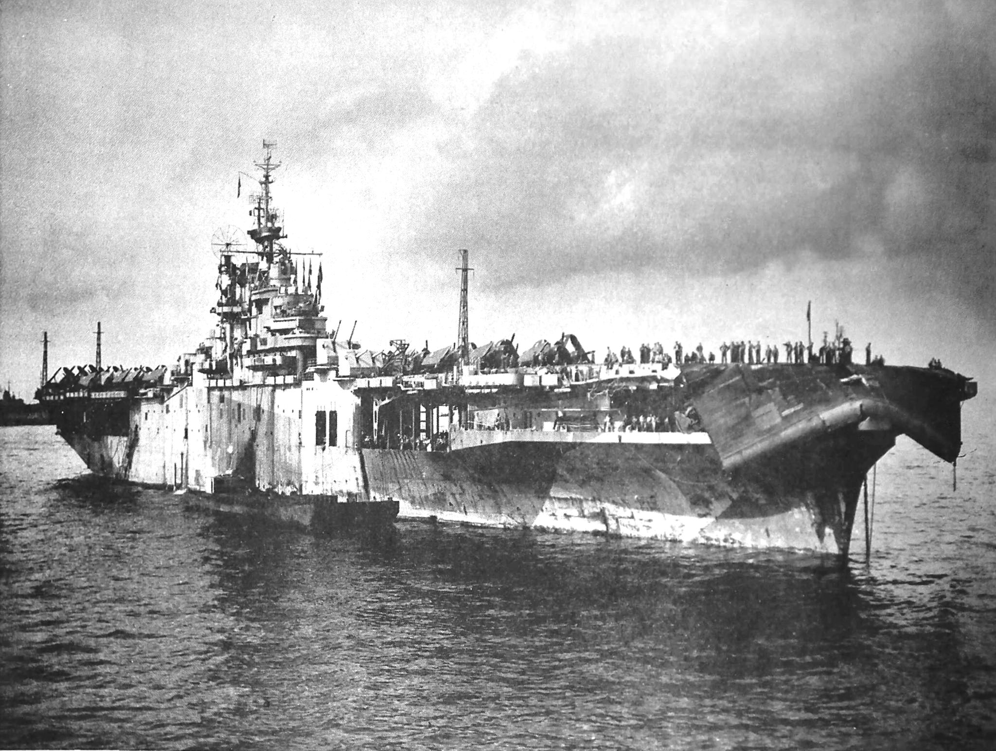 Damage from Typhoon Connie to the forward flight deck of USS Bennington as seen after the ship’s arrival in San Pedro Bay, Leyte, Philippines, 12 Jun 1945. Photo 1 of 3.